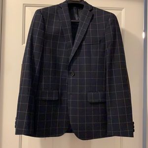 Navy blue plaid print with faux leather elbows.  16R